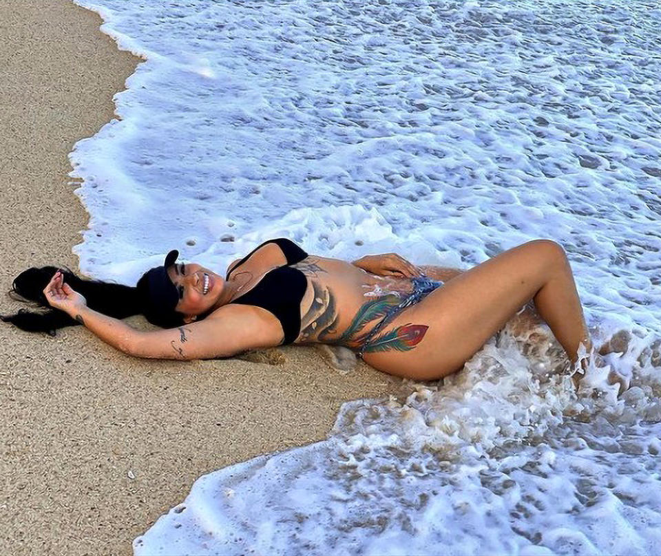 Jenny Miranda lying on the beach