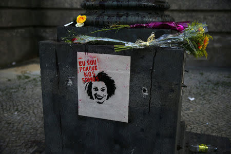 A picture of Rio de Janeiro's city councillor Marielle Franco, 38, who was shot dead, is seen outside the city council chamber in Rio de Janeiro, Brazil, March 15, 2018. The poster reads: "I am because we are". REUTERS/Pilar Olivares