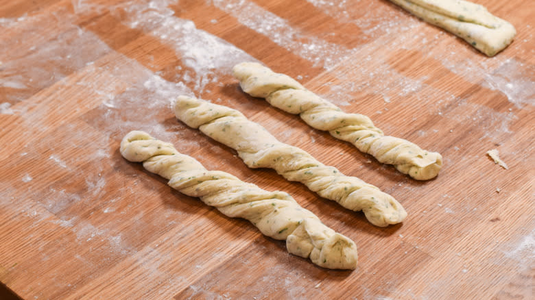 Breadstick dough on cutting board 