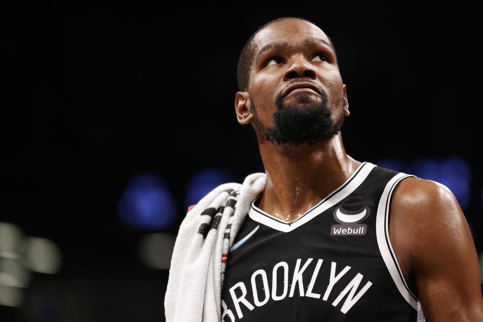 Kevin Durant of the Brooklyn Nets looks on during the first half of the Eastern Conference 2022 Play-In Tournament against the Cleveland Cavaliers at Barclays Center on April 12, 2022 in the Brooklyn borough of New York City.