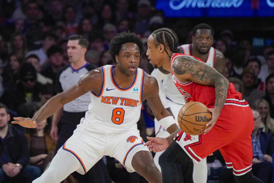 New York Knicks forward OG Anunoby (8) defends Chicago Bulls forward DeMar DeRozan (11) during the first half of an NBA basketball game in New York, Wednesday, Jan. 3, 2024. (AP Photo/Peter K. Afriyie)