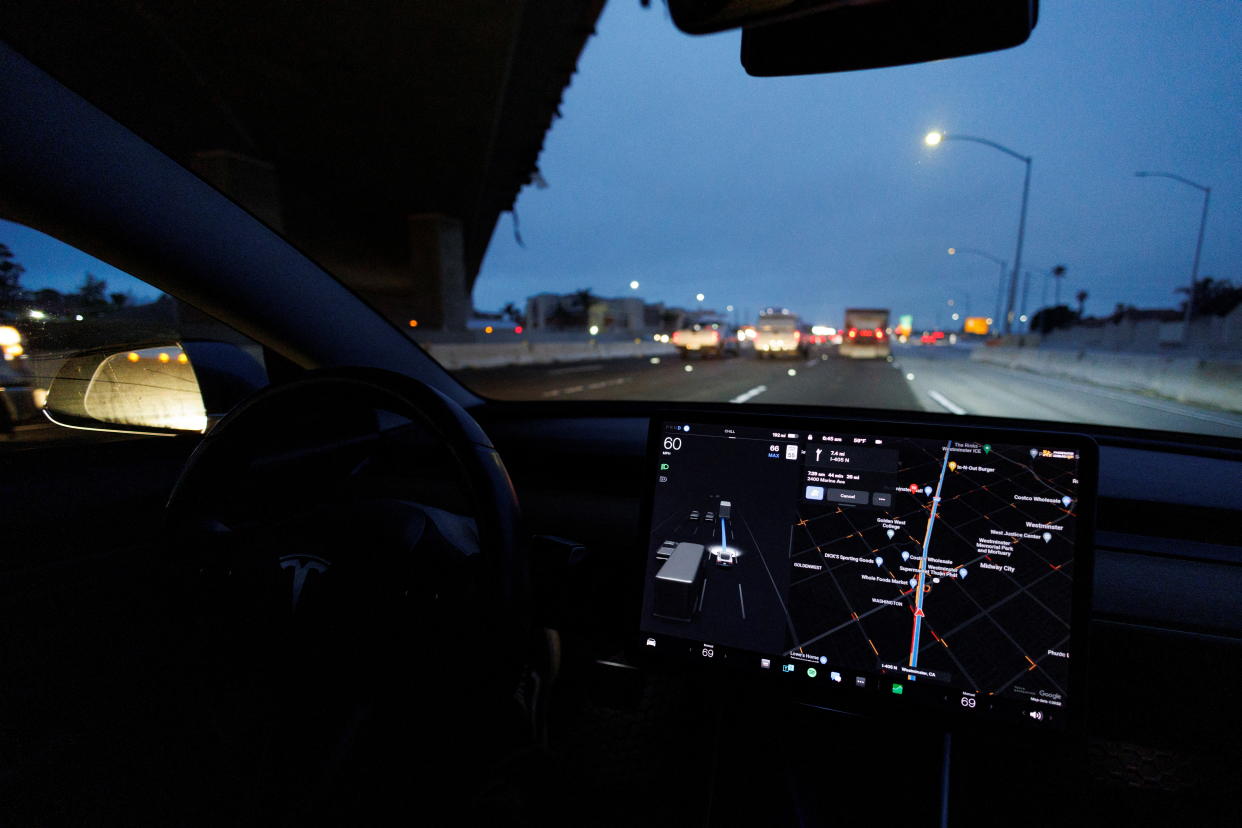 A Tesla Model 3 vehicle drives on autopilot along the 405 highway in Westminster, California, U.S., March 16, 2022. REUTERS/Mike Blake