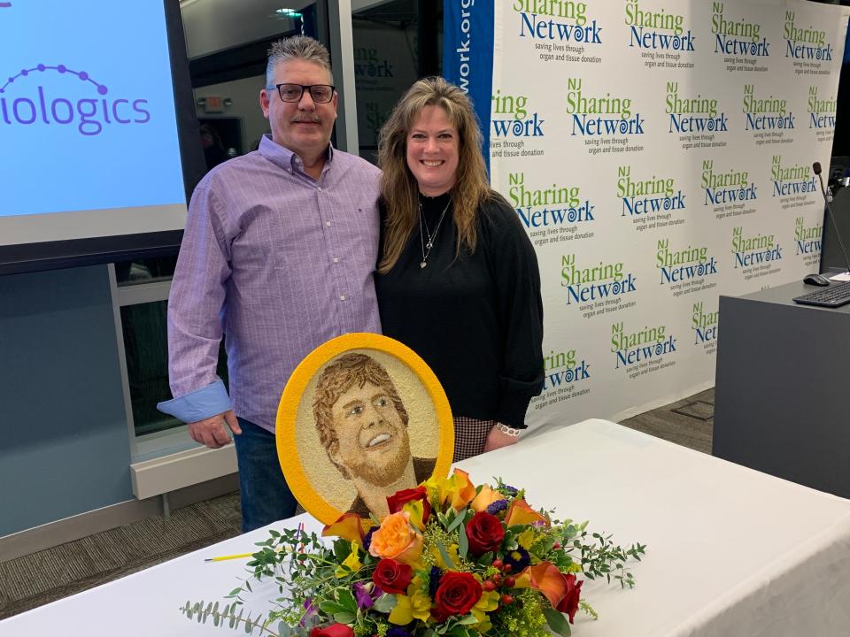 Heather and John Prutzman, the mother and stepfather of Joey Savage IV, gathered at the New Jersey Sharing Network's headquarters in New Providence on Dec. 5, 2022 for the unveiling of a floragraph of Savage that will be featured at the 2023 Rose Parade in California. Savage died in 2017 and his organ and tissue donations helped save four lives and enhanced the lives of 126 others.