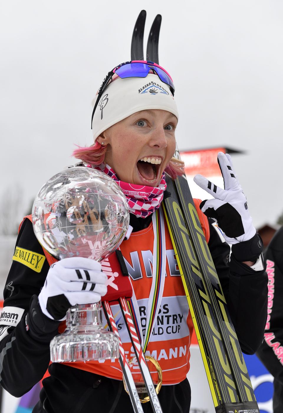 U.S. Kikkan Randall holds the trophy as she celebrates after winning the FIS sprint World Cup cross country ski event in Falun, Sweden, Friday March 14, 2014. (AP photo / Anders Wiklund) SWEDEN OUT