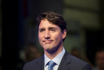 FILE PHOTO: Canada's Prime Minister Justin Trudeau answers questions from the media in Montreal, Quebec, Canada, August 8, 2018.  REUTERS/Christinne Muschi/File Photo