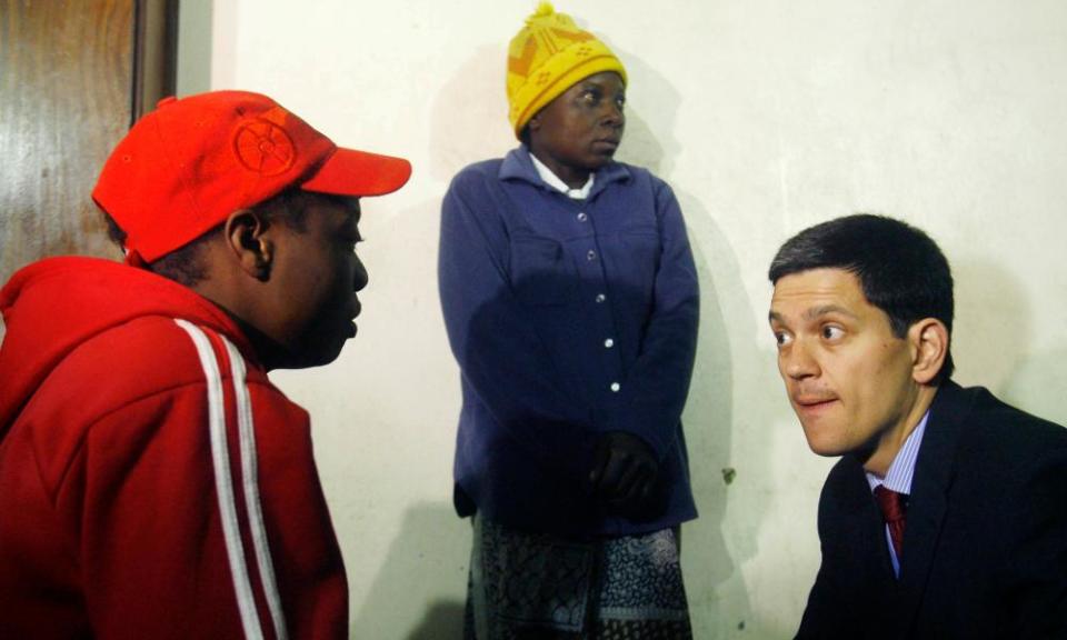 David Miliband with Zimbabwean refugees