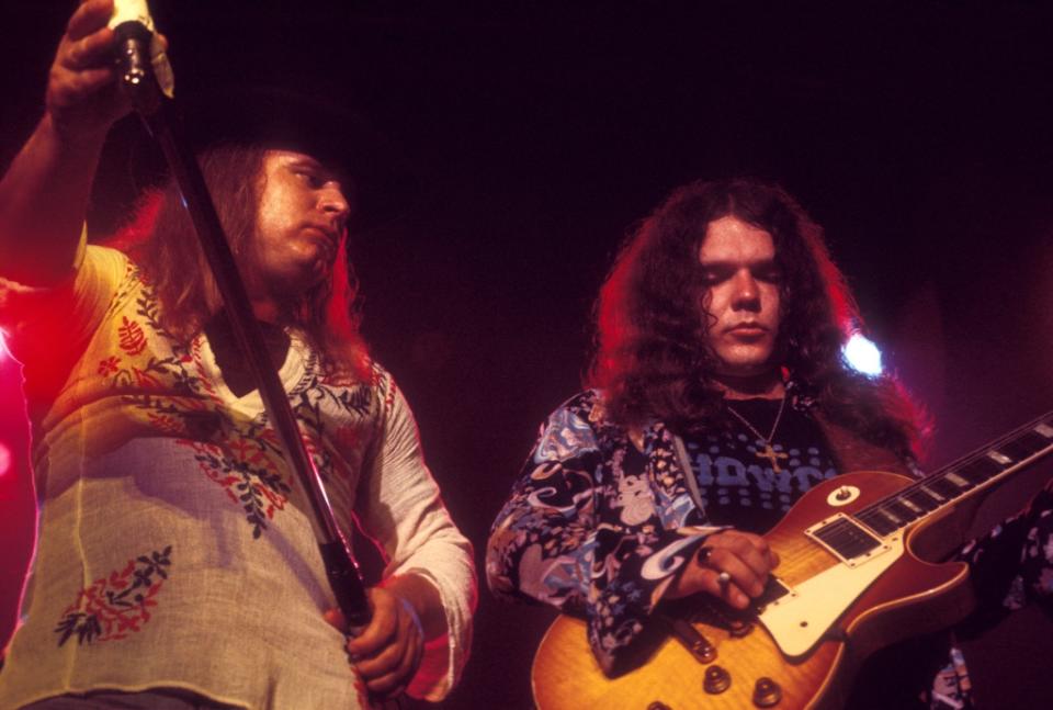 (MANDATORY CREDIT Ebet Roberts/Getty Images) UNITED STATES - JULY 13:  CONVENTION CENTER  Photo of Ronnie VAN ZANT and Gary ROSSINGTON and LYNYRD SKYNYRD, Ronnie Van Zant and Gary Rossington (playing Gibson Les Paul) performing live onstage  (Photo by Ebet Roberts/Redferns)