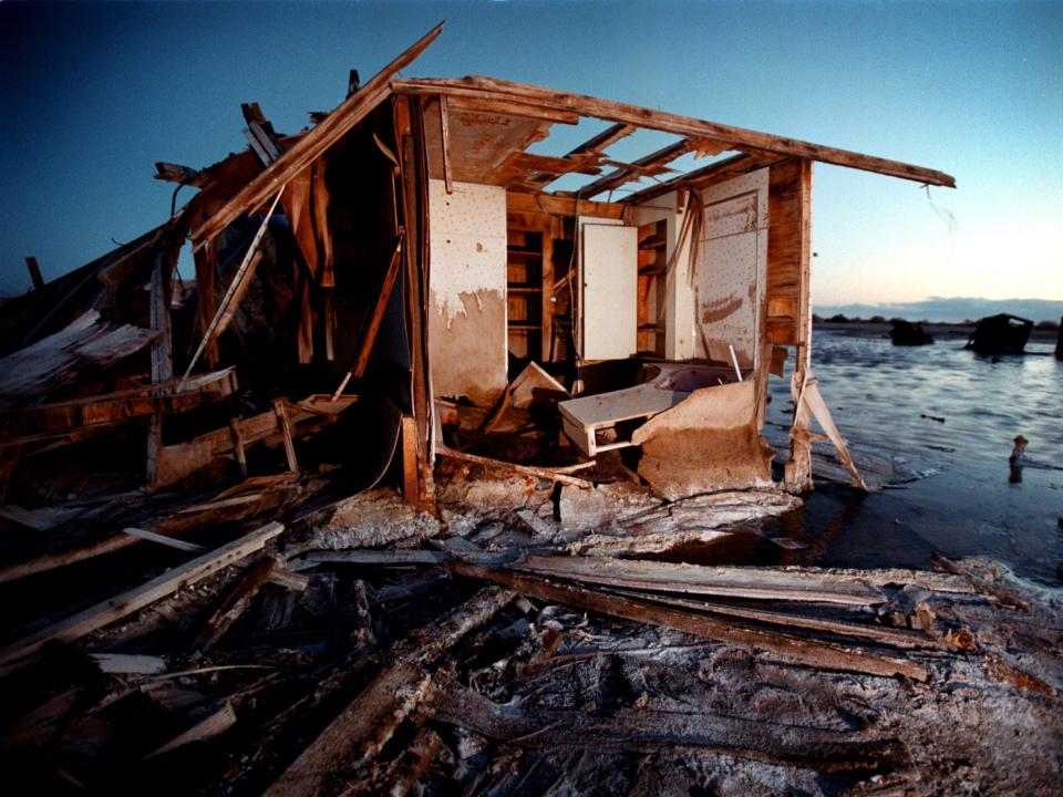 A house trailer crumbles in salty decay as the waters of the Salton Sea rise at Bombay Beach July 28, 2000