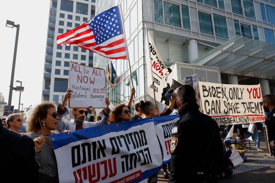 People demonstrate outside the David Kempinski Hotel in Tel Aviv on Jan. 9, 2024, as Secretary of State Antony Blinken visits Israel.