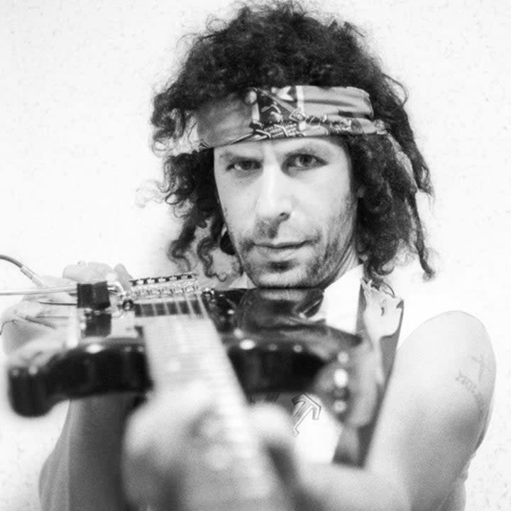 Randy California of the band Spirit points his guitar at the camera