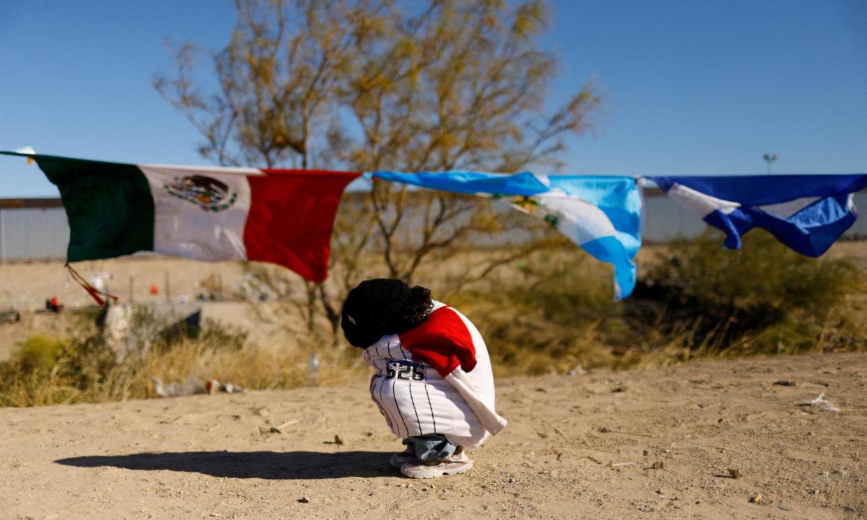 <span>A young nigrant girl from Venezuela at the US-Mexico border. A record number of people are seeking refuge in the US.</span><span>Photograph: José Luis González/Reuters</span>