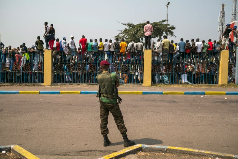 Supporters of veteran opposition chief Etienne Tshisekedi wait for his arrival at the airport of Kinshasa, on July 27, 2016