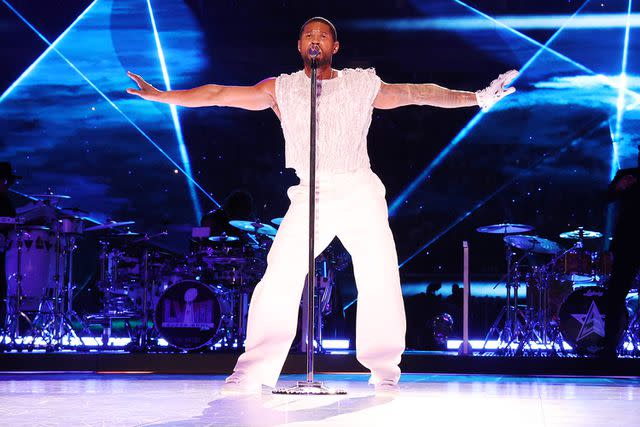 <p>Kevin Mazur/Getty</p> Usher performs onstage during the Apple Music Super Bowl LVIII Halftime Show at Allegiant Stadium on February 11, 2024 in Las Vegas, Nevada.