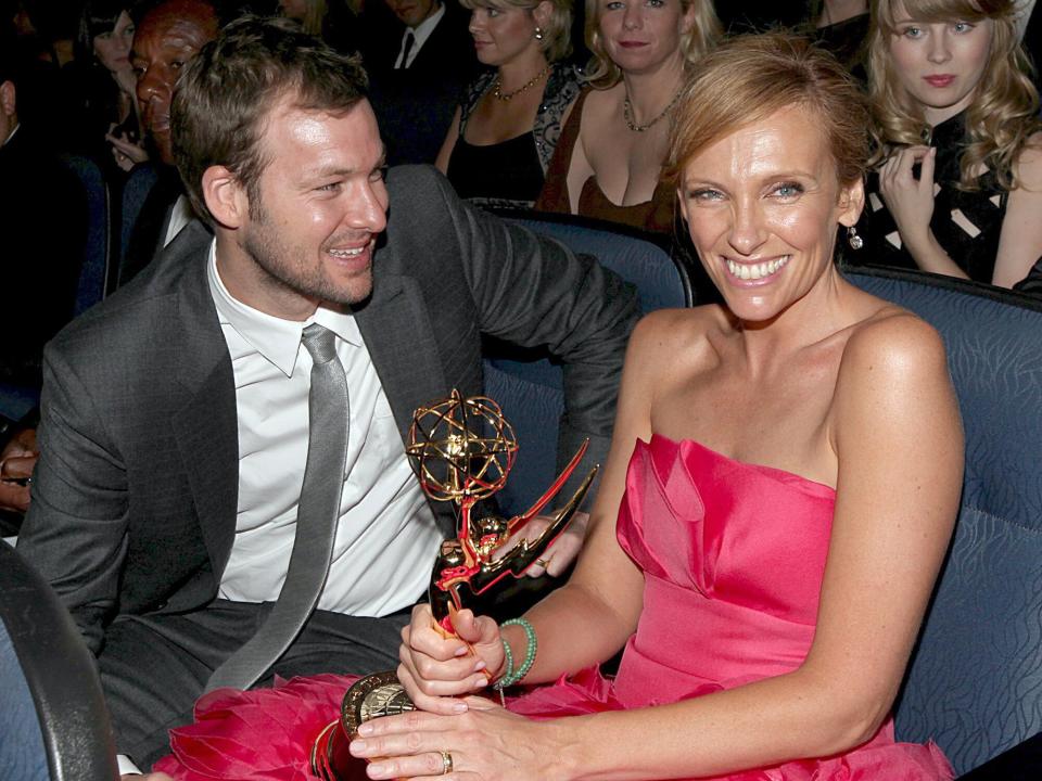 Toni Collette holds her Emmy as husband Dave Galafassi sits in the audience at the 61st Annual Primetime Emmy Awards, held at the Nokia Theatre, on September 20, 2009 in Los Angeles