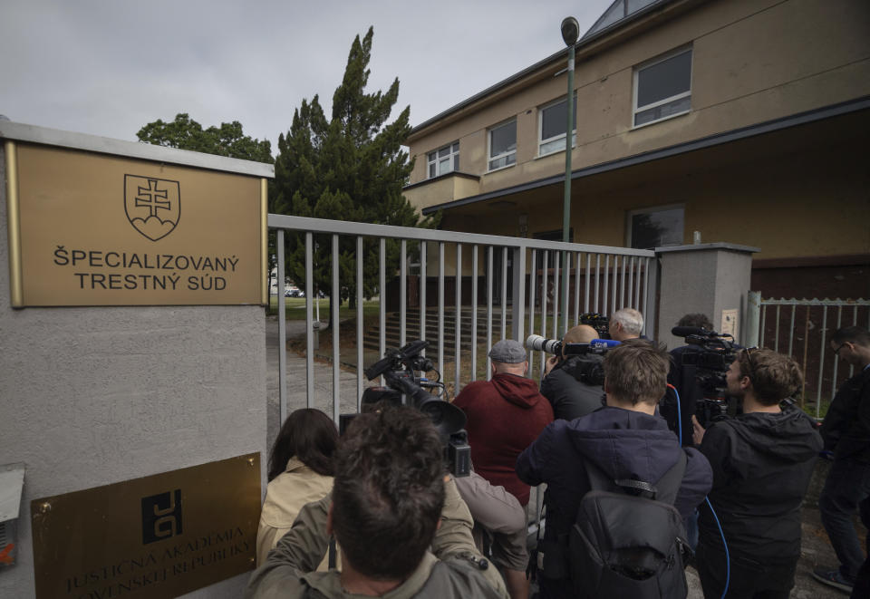 Journalists gather as they wait for the suspect, in shooting of Slovakia's Prime Minister Robert Fico, to be brought to court in Pezinok, Slovakia, Saturday, May 18, 2024. Officials in Slovakia say Prime Minister Robert Fico has undergone another operation two days after his assassination attempt and remains in serious condition. (AP Photo/Tomas Benedikovic)