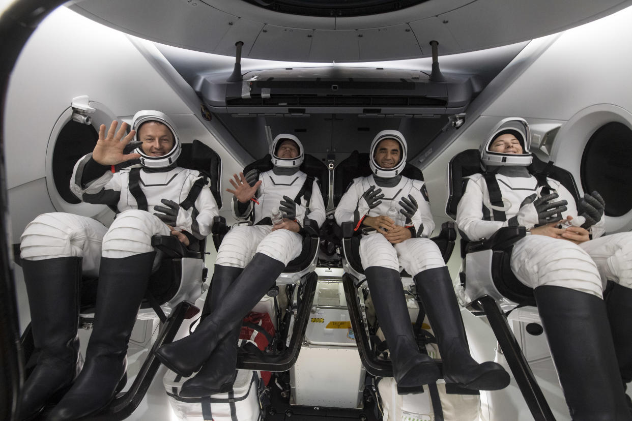 In this handout photo provided by NASA, (L-R) ESA (European Space Agency) astronaut Matthais Maurer, NASA astronauts Tom Marshburn, Raja Chari, and Kayla Barron, are seen inside the SpaceX Crew Dragon Endurance spacecraft onboard the SpaceX Shannon recovery ship shortly after having landed in the Gulf of Mexico on May 6, 2022 off the coast of Tampa, Florida. Maurer, Marshburn, Chari, and Barron are returning after 177 days in space as part of Expeditions 66 and 67 aboard the International Space Station. (Photo by Aubrey Gemignani/NASA via Getty Images)