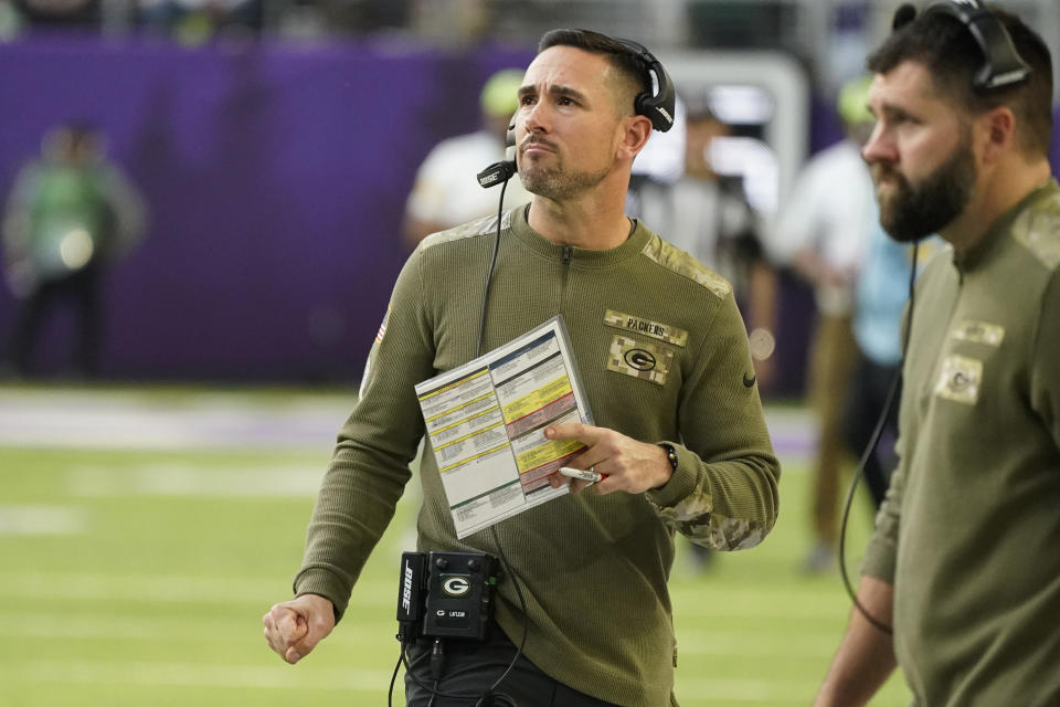 Green Bay Packers head coach Matt LaFleur watches from the sideline during the second half of an NFL football game against the Minnesota Vikings, Sunday, Nov. 21, 2021, in Minneapolis. (AP Photo/Jim Mone)