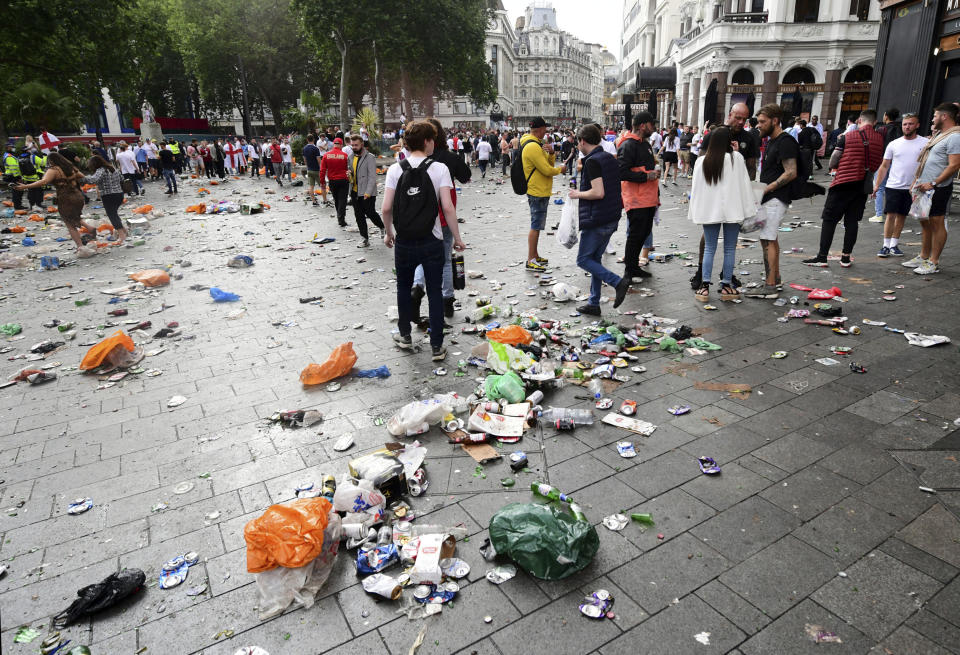 Rubbish left in the wake of fans gathered in Leicester Square central London, Sunday July 11, 2021, ahead of the Euro 2020 soccer championship final match between England and Italy, at Wembley Stadium, in London. (Ian West/PA via AP)