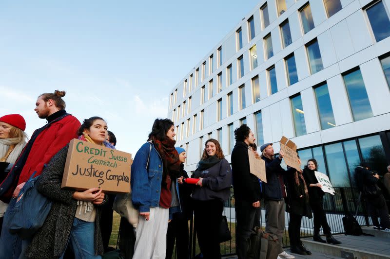 Activists protest outside the District Court of West Lausanne before the trial of twelve activists for a protest inside a branch of Credit Suisse bank in 2018 in Renens