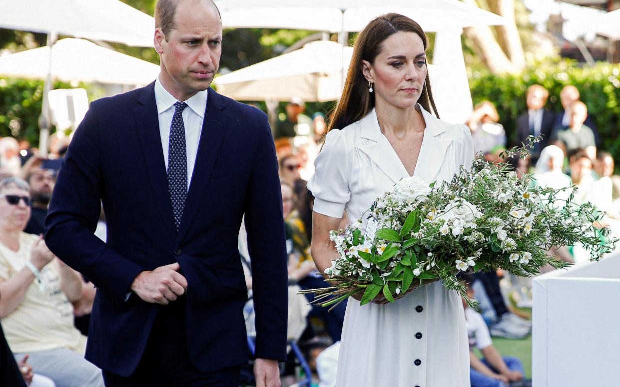 Prince William and Kate lay a wreath during the Grenfell Tower memorial service - PETER NICHOLLS/AFP