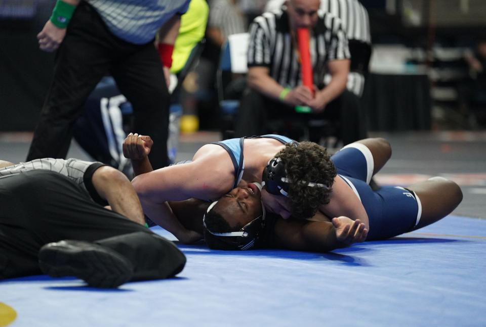 Carmel's Leo Venables wrestles a quarterfinal match at the NYSPHSAA Wrestling Championships at MVP Arena in Albany, on Friday, February 24, 2023.