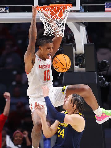 <p>Kevin C. Cox/Getty</p> Julian Reese dunks the ball against Patrick Suemnick of the West Virginia Mountaineers during the second half in the first round of the NCAA Men's Basketball Tournament on March 16, 2023 in Birmingham, Alabama.