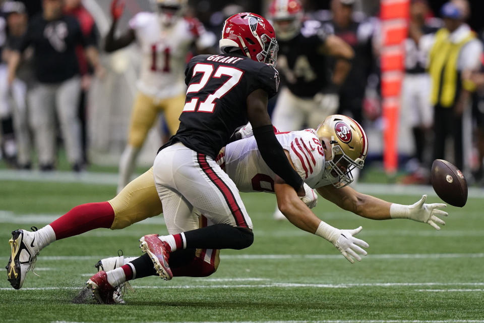 San Francisco 49ers tight end Charlie Woerner (89) misses the catch as Atlanta Falcons safety Richie Grant (27) defends during the second half of an NFL football game, Sunday, Oct. 16, 2022, in Atlanta. (AP Photo/Brynn Anderson)