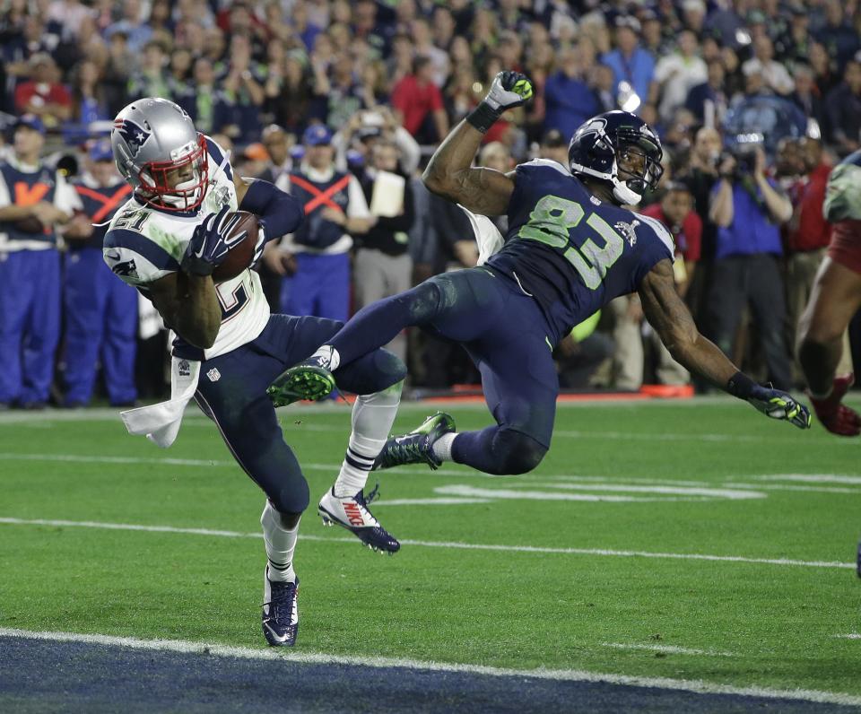 FILE - New England Patriots strong safety Malcolm Butler (21) intercepts a pass intended for Seattle Seahawks wide receiver Ricardo Lockette (83) during the second half of NFL Super Bowl XLIX football game Sunday, Feb. 1, 2015, in Glendale, Ariz. Butler was an "invited tryout" player who got his chance in May of 2014. Nine months later, his first career interception saved the Super Bowl for the Patriots when he dug inside Seahawks receiver Ricardo Lockette to pick off Russell Wilson's pass from the 1 with 20 seconds remaining to preserve New England's 28-24 win. (AP Photo/Kathy Willens, File)