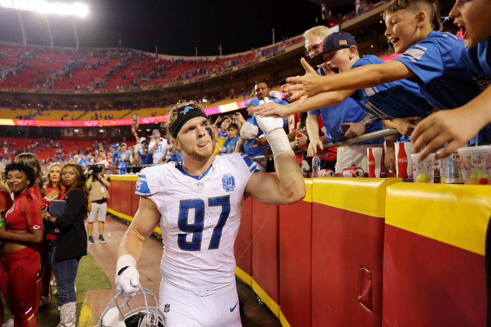 KANSAS CITY, MISSOURI – SEPTEMBER 07: Aidan Hutchinson #97 of the Detroit Lions celebrates their win over the Kansas City Chiefs with fans at GEHA Field at Arrowhead Stadium on September 07, 2023 in Kansas City, Missouri. (Photo by Jamie Squire/Getty Images)
