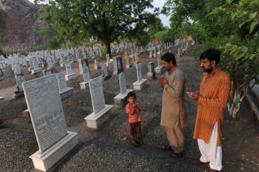 People offer prayers at the grave of Professor Abdus Salam in Rabwah. "Even after he was buried, local administration asked the Ahmadi community to remove the word 'Muslim' from the inscription on the grave which said 'the first Muslim Nobel laureate," says Hassan Amir Shah, head of the physics department at Government College, Lahore