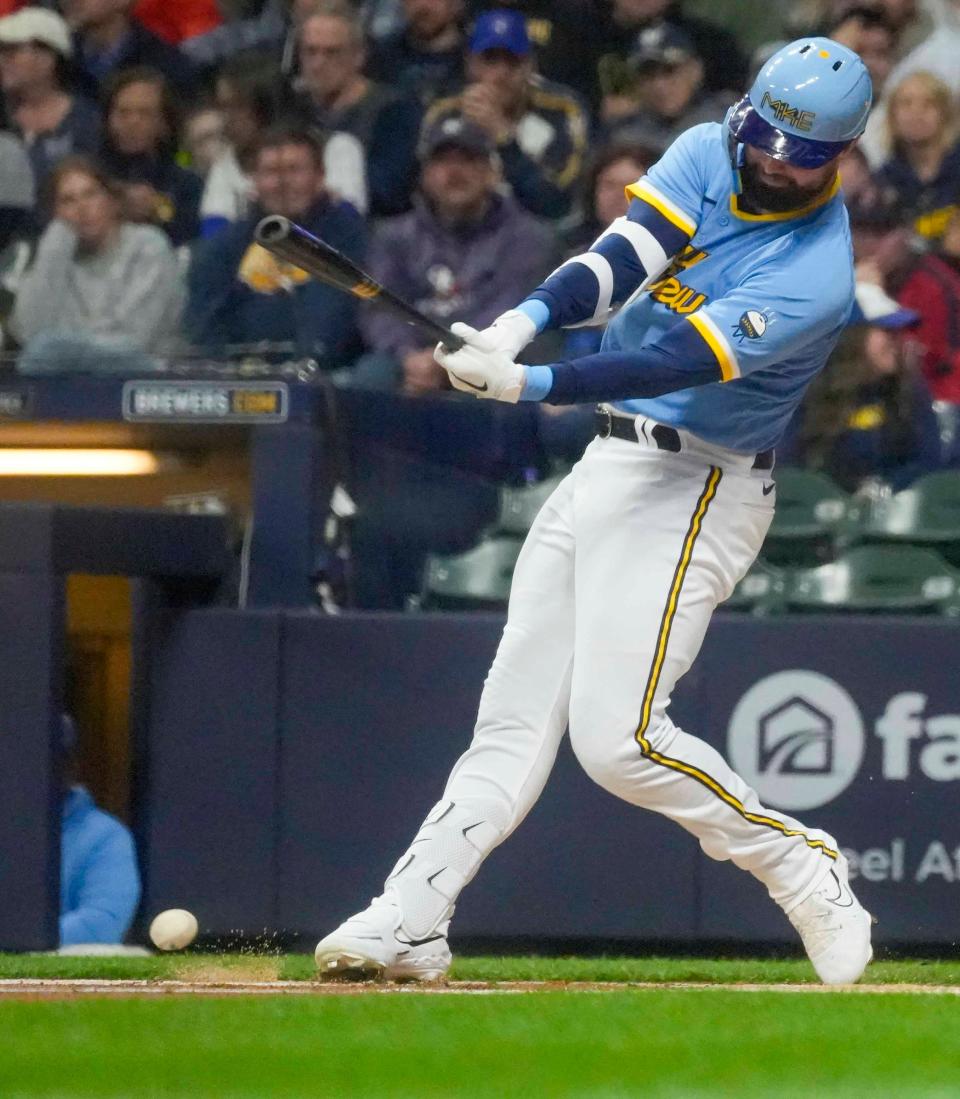 Milwaukee Brewers left fielder Jesse Winker (33) hits the ball during the first inning against Boston Red Sox Friday, April 21, 2023, at American Family Field in Milwaukee.