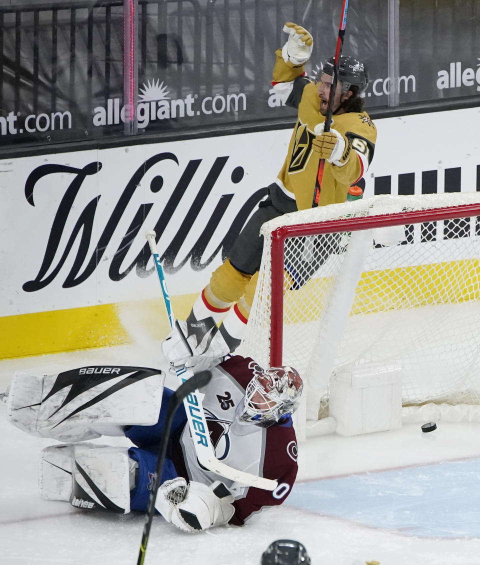 Vegas Golden Knights right wing Mark Stone (61) celebrates after making an assist against the Colorado Avalanche during the third period of an NHL hockey game Wednesday, April 28, 2021, in Las Vegas. (AP Photo/John Locher)