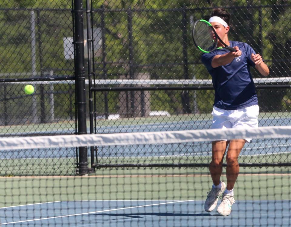 Hayden's Joseph Luke hits a shot during the Class 3-1A State Tennis Tournament in Prairie Village on Saturday, May 11.