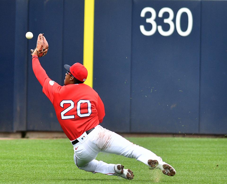 Worcester's Jeter Downs makes a diving catch in a game earlier this season.