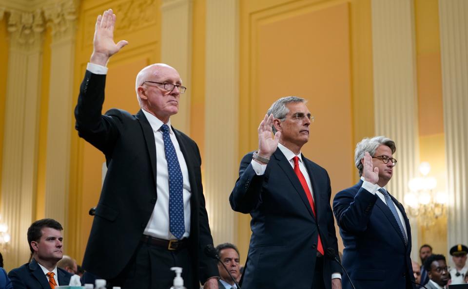 From left, Arizona House Speaker Rusty Bowers,  Georgia Secretary of State Brad Raffensperger and Gabe Sterling, chief operating officer of Georgia's secretary of state office, are sworn in before testifying to the Jan. 6 committee hearings on June 21, 2022.