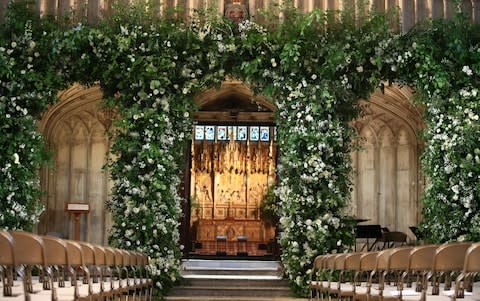 Flowers adorn the front of the organ loft inside St George's Chapel - Credit: Danny Lawson /PA