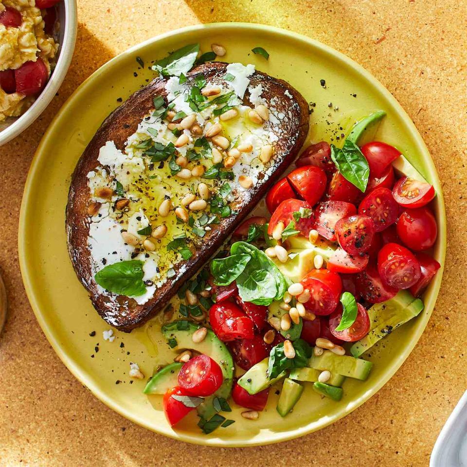 <p>This simple lunch comes together in just 10 minutes, making it a great option for busy days. <a href="https://www.eatingwell.com/recipe/281185/open-face-goat-cheese-sandwich-with-tomato-avocado-salad/" rel="nofollow noopener" target="_blank" data-ylk="slk:View Recipe" class="link ">View Recipe</a></p>