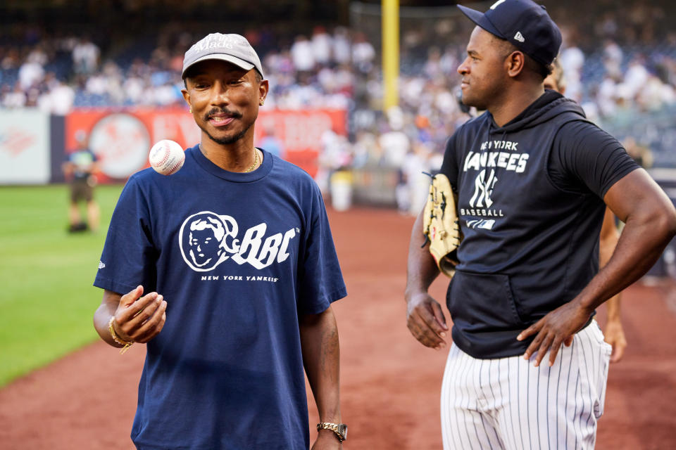 Pharrell Williams with New York Yankees pitcher Luis Severino. - Credit: Masato Onoda/WWD