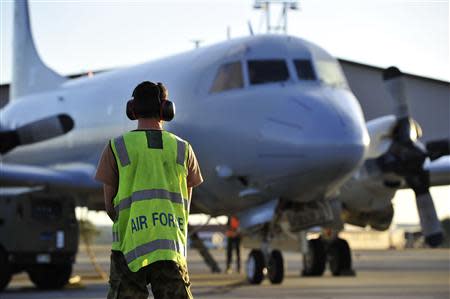 The AP-3C Orion returns to the RAAF Base Pearce after a day of searching an area in the Indian Ocean for the missing Malaysia Airlines Flight MH370 April 8, 2014. REUTERS/Richard Polden