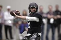 Texas A&M quarterback Johnny Manziel passes the ball during a drill at pro day for NFL football representatives in College Station, Texas, Thursday, March 27, 2014. (AP Photo/Patric Schneider)