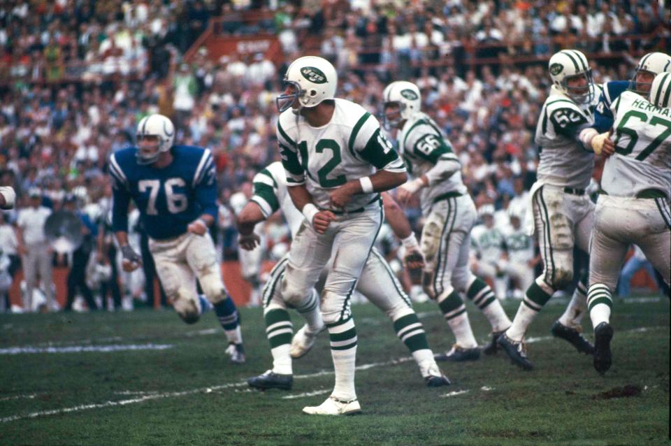 New York Jets quarterback (12) Joe Namath gets off a pass under pressure from the Baltimore Colts defenders during Super Bowl III in Miami, Fla., on Sunday, Jan. 12, 1969. (AP Photo)