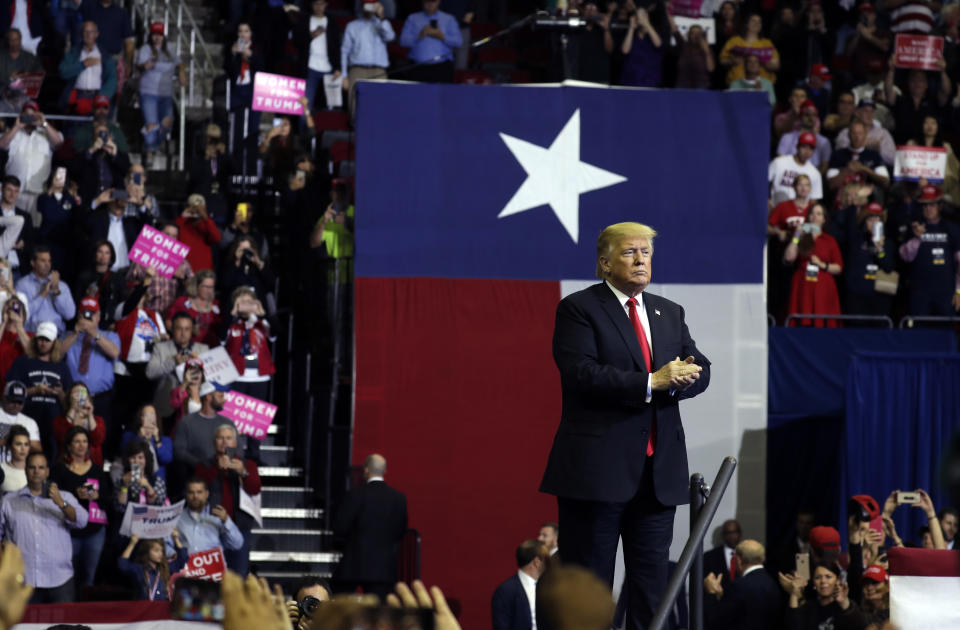 President Donald Trump applauds during a campaign rally for Sen. Ted Cruz, R-Texas, at Houston Toyota Center, Monday, Oct. 22, 2018, in Houston. (AP Photo/Evan Vucci)