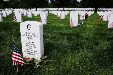 A U.S. flag flies next to the grave marker of U.S. Army Captain Humayun Khan inside of Section 60 in Arlington National Cemetery on Memorial Day, May 30, 2016. REUTERS/Lucas Jackson