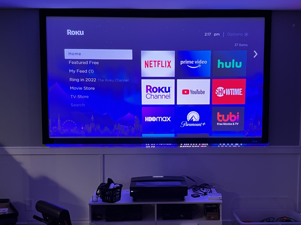 The Bomaker Polaris 4K projector shown running a Roku Streaming Stick.