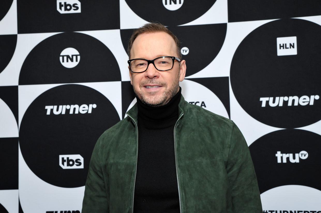 Donnie Wahlberg poses wearing glasses