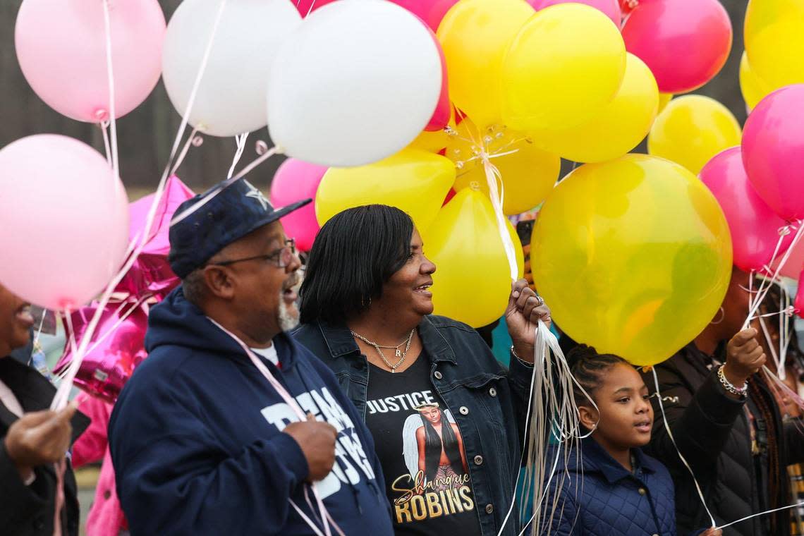 Family and friends sing happy birthday at the graveside of Shanquella Robinson, on what would have been her 26th birthday, at Beatties Ford Memorial Garden, where she is buried, on Sunday, January 8, 2023.