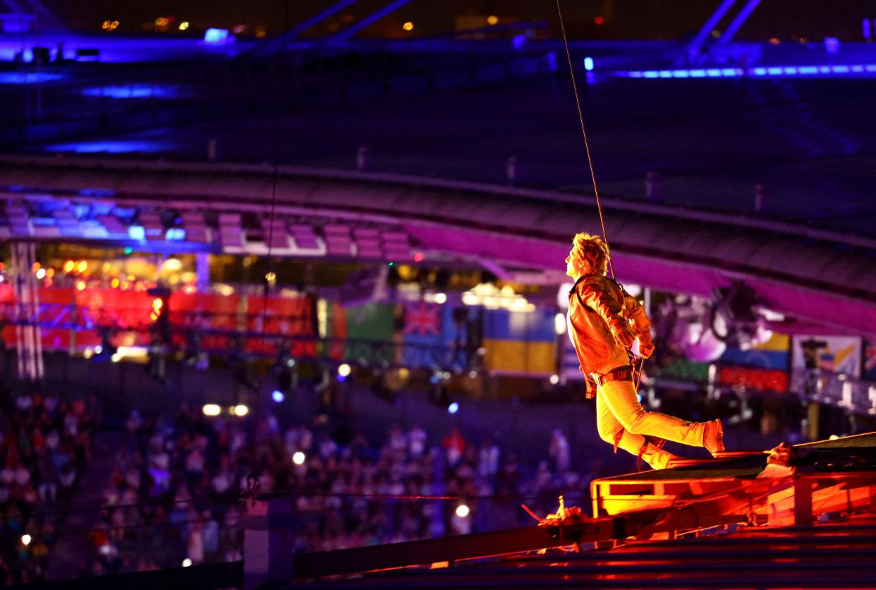 Actor Tom Cruise jumps off the roof of the Stade de France, during the closing ceremony of the 2024 Summer Olympics, at the Stade de France, Sunday, Aug. 11, 2024, in Saint-Denis, France. (Fabrizio Bensch/Pool Photo via AP)