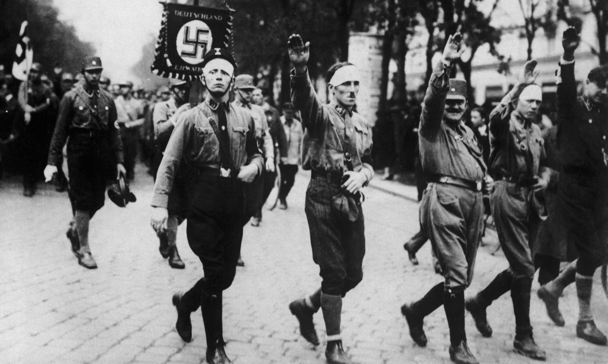 <span>War veterans join a Nazi parade in Vienna in about 1930. Karl Polanyi fled the city for Britain.</span><span>Photograph: FPG/Getty Images</span>