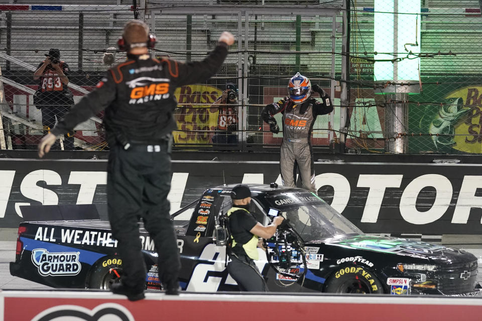 Sam Mayer, right, celebrates his win in the NASCAR Truck Series auto race Thursday, Sept. 17, 2020, in Bristol, Tenn. (AP Photo/Steve Helber)