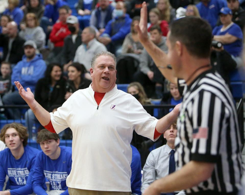 Lake head coach Tom McBride makes a point to an official during their game against Green on Tuesday.